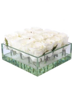 White roses in squate glass vase